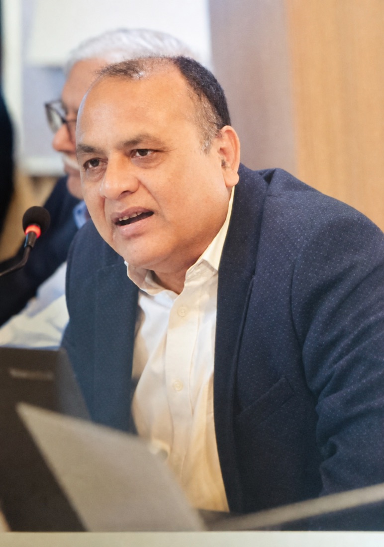 Naveen Kumar speaking at a meeting